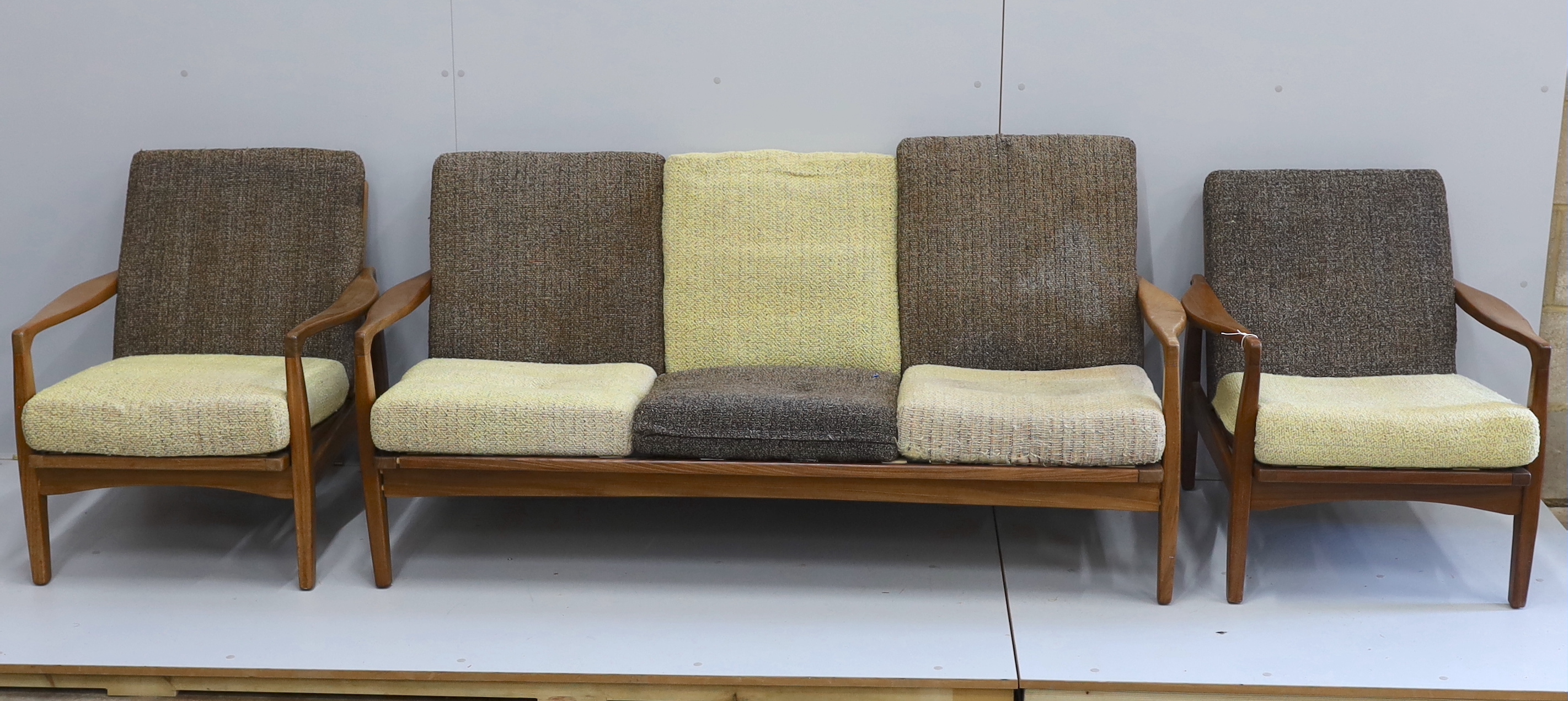 In the manner of Zenon Baczyk, a mid century teak three piece lounge suite, settee length 168cm, depth 88cm, height 68cm